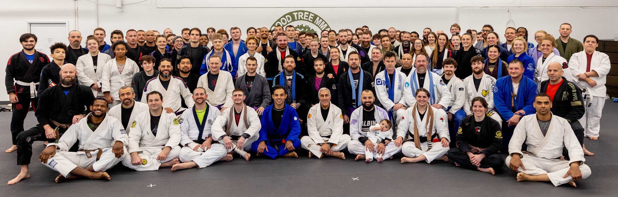 group photo of coaches and students of Good Tree MMA